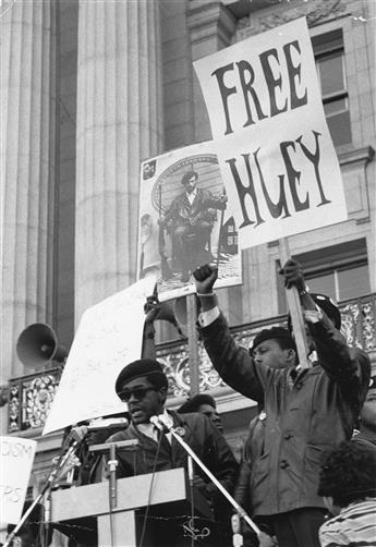(BLACK PANTHERS) Group of 18 photographs depicting members of the Black Panther Party, including Eldridge Cleaver, with Free Huey pro